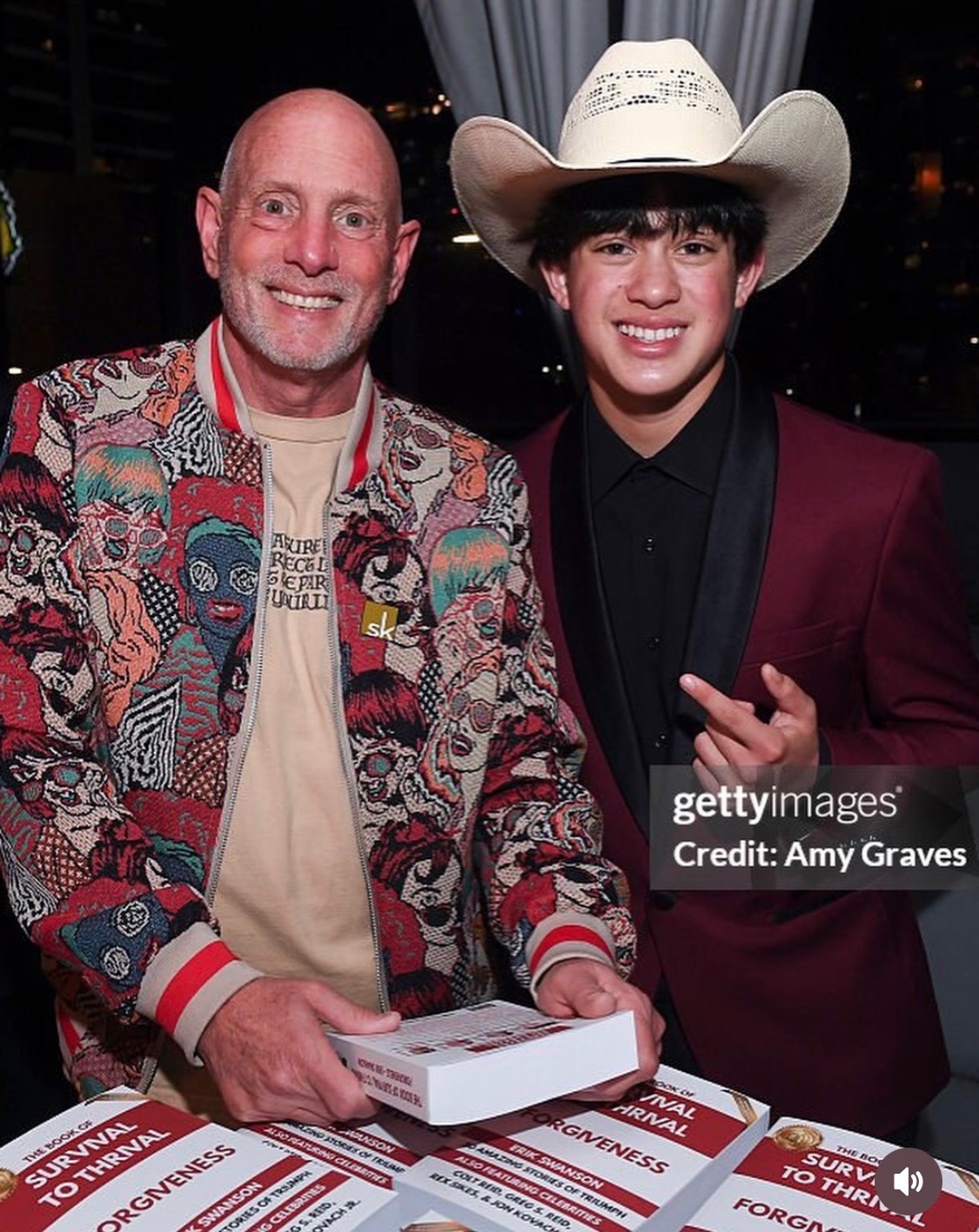 Colt Reid at a book signing with his dad